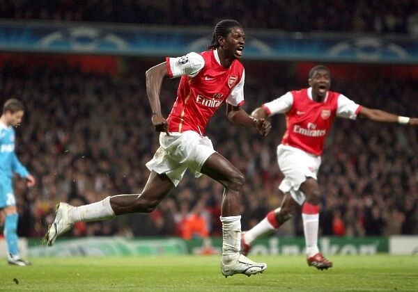 Emmanuel Adebayor (Arsenal) celebrates the own goal scored by Alex (PSV, not pictured)