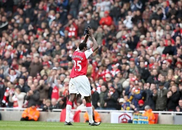 Emmanuel Adebayor (Arsenal) claps the fans as he leaves the pitch