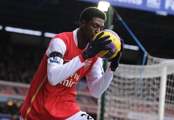 Emmanuel Adebayor (Arsenal) kisses the matchball