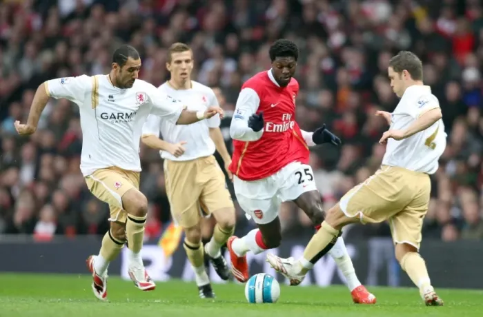 Framed Print : Emmanuel Adebayor (Arsenal) Mohamed Shawky and Luke Young (Boro) Framed Print : Emmanuel Adebayor (Arsenal) Mohamed Shawky and Luke Young (Boro)
