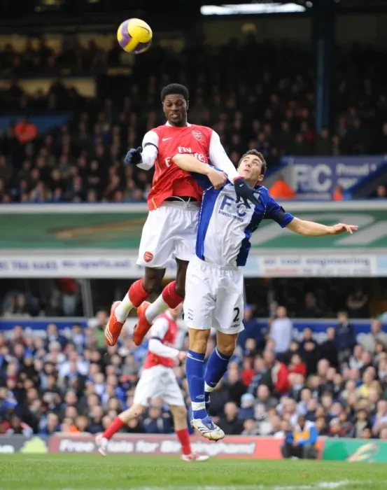 Framed Print : Emmanuel Adebayor (Arsenal) Stephen Kelly (Birmingham City)