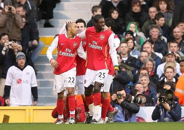 Emmanuel Adebayor celebrates scoring the 1st Arsenal goal with Gael Clichy