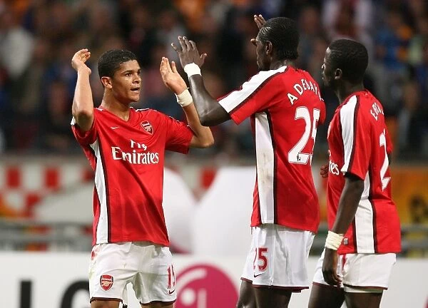Emmanuel Adebayor celebrates scoring the 3rd Arsenal