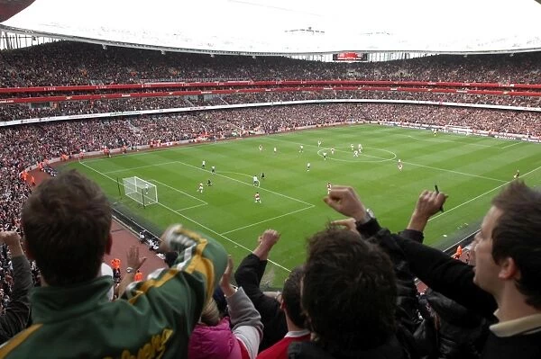 Emmanuel Adebayor celebrates scoring Arsenals 1st goal