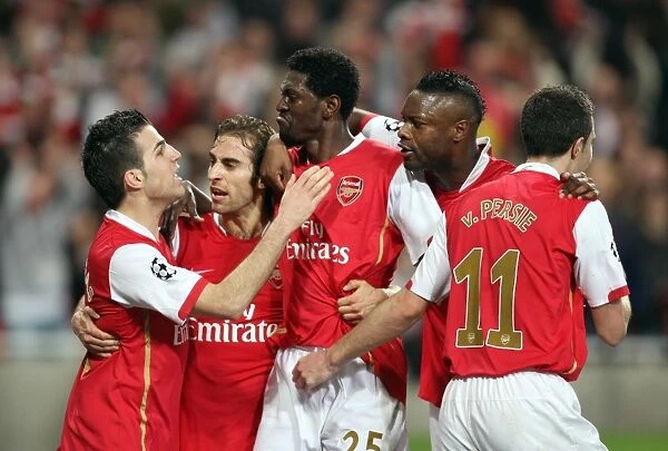 Emmanuel Adebayor celebrates scoring Arsenals goal with Cesc Fabregas