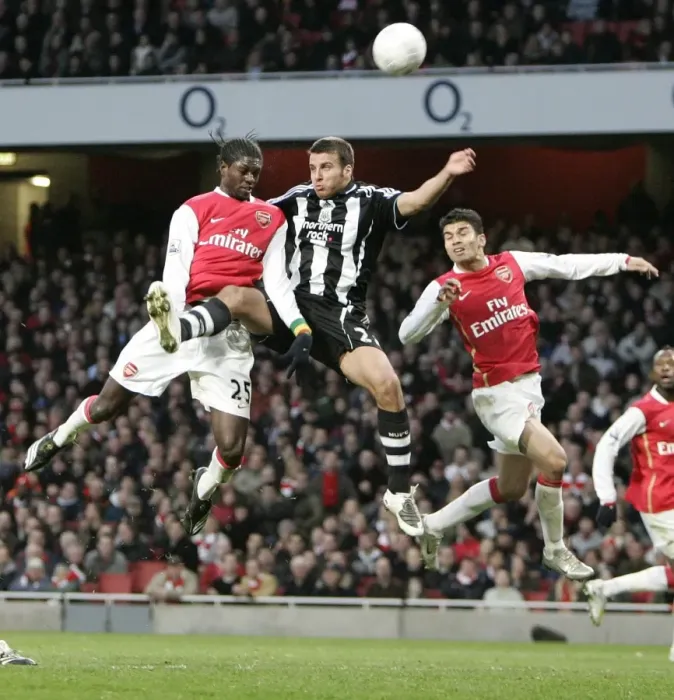 Framed Print : Emmanuel Adebayor and Eduardo (Arsenal) jump with Steven Taylor (Newcastle) Framed Print : Emmanuel Adebayor and Eduardo (Arsenal) jump with Steven Taylor (Newcastle)