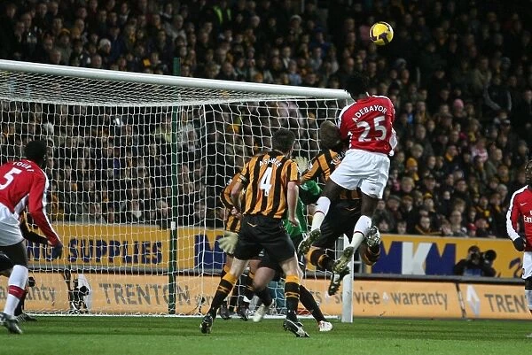 Emmanuel Adebayor heads over Hull goalkeeper Boaz Myhill