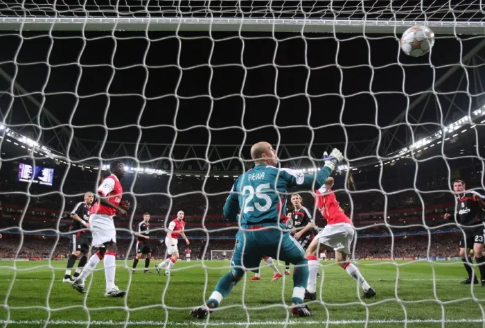 Framed Print : Emmanuel Adebayor heads past Liverpool Pepe Reina to scote the Arsenal goal Framed Print : Emmanuel Adebayor heads past Liverpool Pepe Reina to scote the Arsenal goal