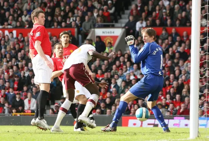 Framed Print : Emmanuel Adebayor heads past Manchester United goalkeeper Edwin van der Sar to score the Arsenal goal. Manchester United 2: 1 Arsenal, Barclays Premier League, Old Trafford, Manchester, 13  /  4  /  2008. Credit : Stuart MacFarlane  /  Arsenal