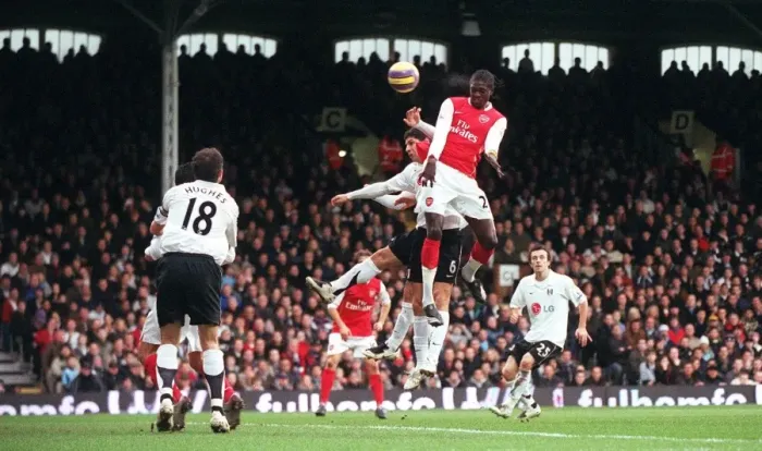 Framed Print : Emmanuel Adebayor scores Arsenals 1st goal under pressure from Dejan Stefanovic Framed Print : Emmanuel Adebayor scores Arsenals 1st goal under pressure from Dejan Stefanovic