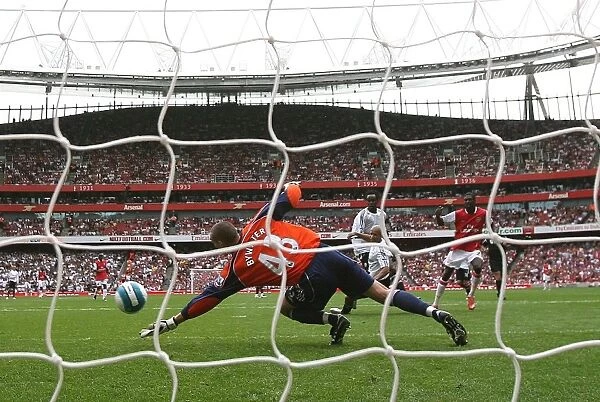Emmanuel Adebayor scores Arsenals 5th goal past Stephen Bywater (Derby)