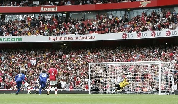 Emmanuel Adebayor scores Arsenals goal from the penalty spot
