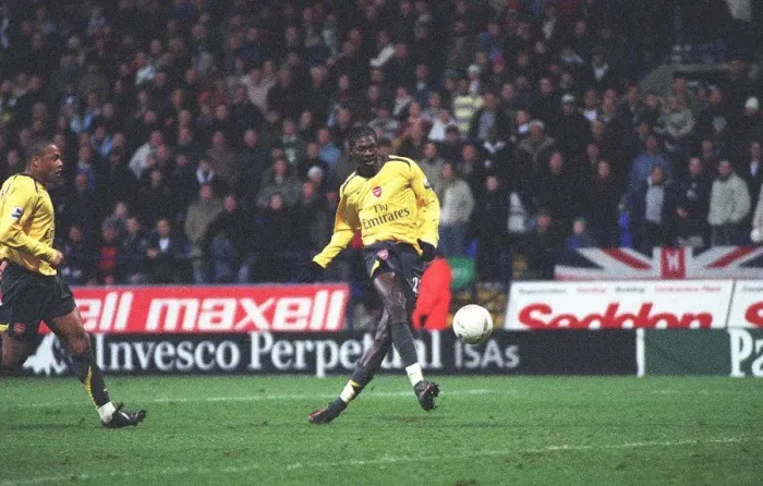 Framed Print : Emmanuel Adebayor shoots into an empty net to score the 3rd Arsenal goal