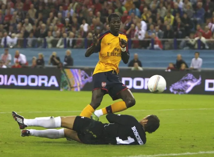 Framed Print : Emmanuel Adebayor shoots past FC Twente goalkeeper Framed Print : Emmanuel Adebayor shoots past FC Twente goalkeeper