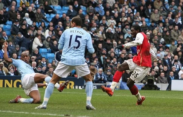 Emmanuel Adebayor shoots past Joe Hart to score his 2nd and Arsenals 3rd goal