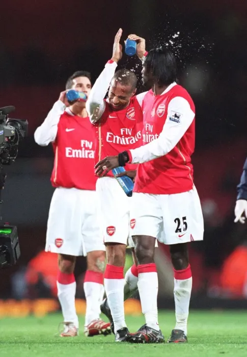 Framed Print : Emmanuel Adebayor squirts water at Thierry Henry (Arsenal) at the end of the match Framed Print : Emmanuel Adebayor squirts water at Thierry Henry (Arsenal) at the end of the match