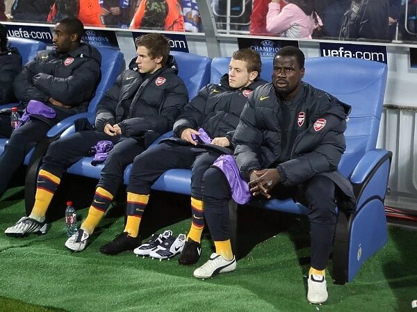 Emmanuel Eboue on the Arsenal bench before the match