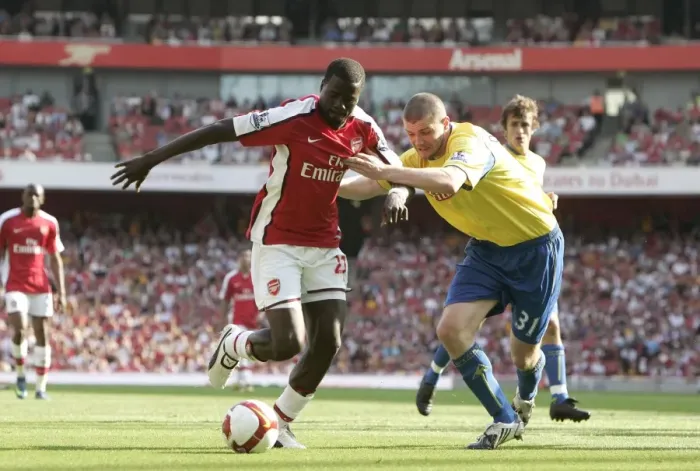 Framed Print : Emmanuel Eboue (Arsenal) Carl Dickinson (Stoke)