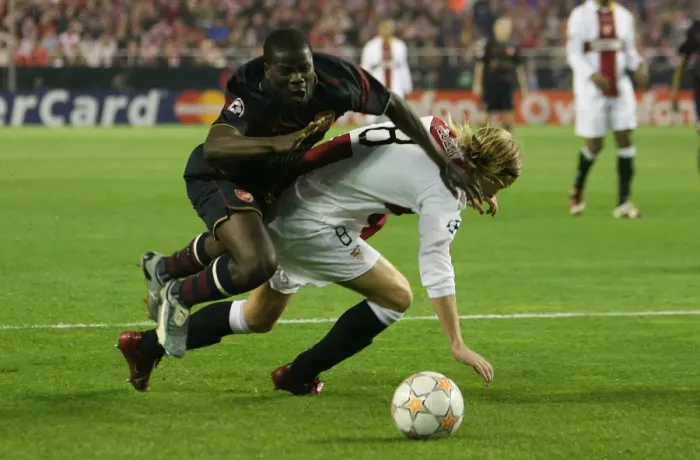 Framed Print : Emmanuel Eboue (Arsenal) Christian Poulsen (Seville) Framed Print : Emmanuel Eboue (Arsenal) Christian Poulsen (Seville)