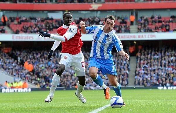 Emmanuel Eboue (Arsenal) Gary Roberts (Huddersfield). Arsenal 2:1 Huddersfield Town