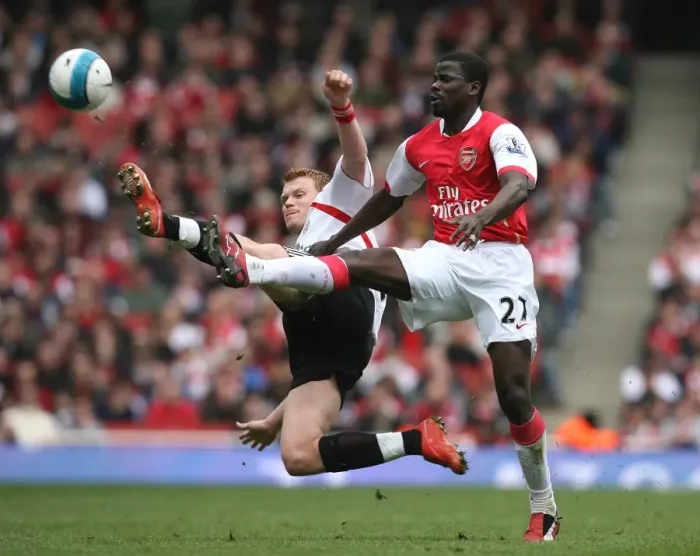 Framed Print : Emmanuel Eboue (Arsenal) John Arne Riise (Liverpool)