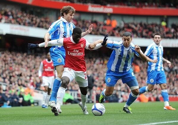 Emmanuel Eboue (Arsenal) Lee Peltier and Kevin Kilbane (Huddersfield). Arsenal 2
