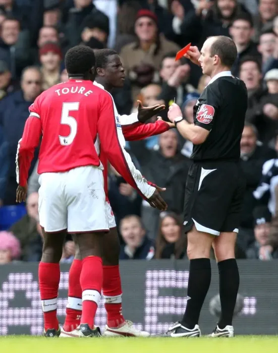 Framed Print : Emmanuel Eboue (Arsenal) is shown the Red Card by referee Mike Dean