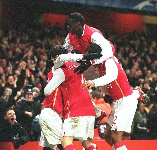 Emmanuel Eboue celebrates scoring Arsenals 2nd goal with Cesc Fabregas
