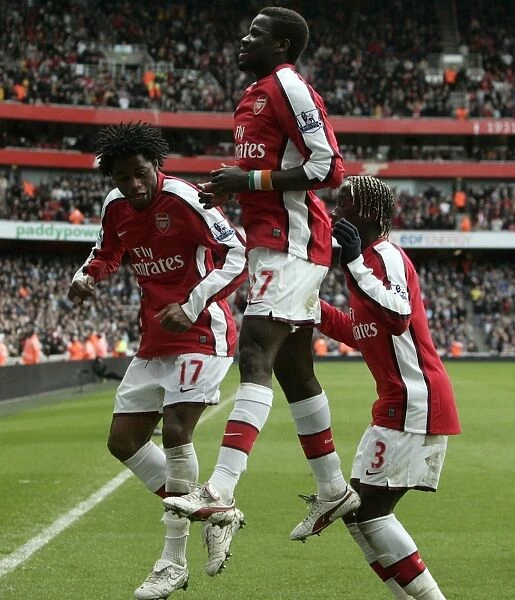 Emmanuel Eboue celebrates scoring Arsenals 3rd goal