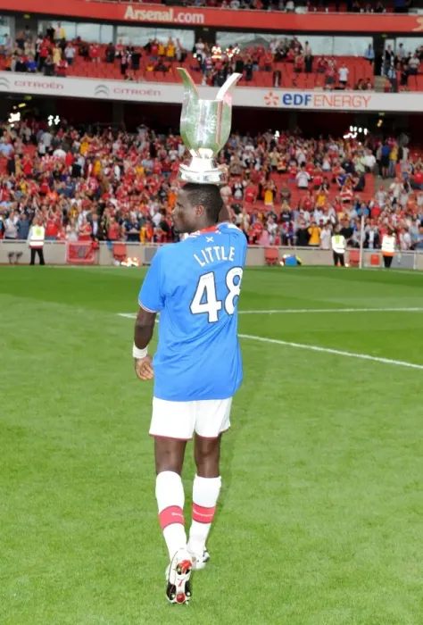 Framed Print : Emmanuel Eboue Celebrating Arsenal's Emirates Cup Victory over Rangers