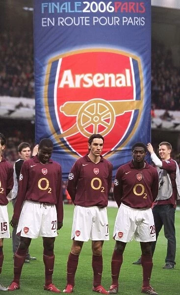 Emmanuel Eboue, Robert Pires and Kolo Toure (Arsenal) line up with an banner behind them