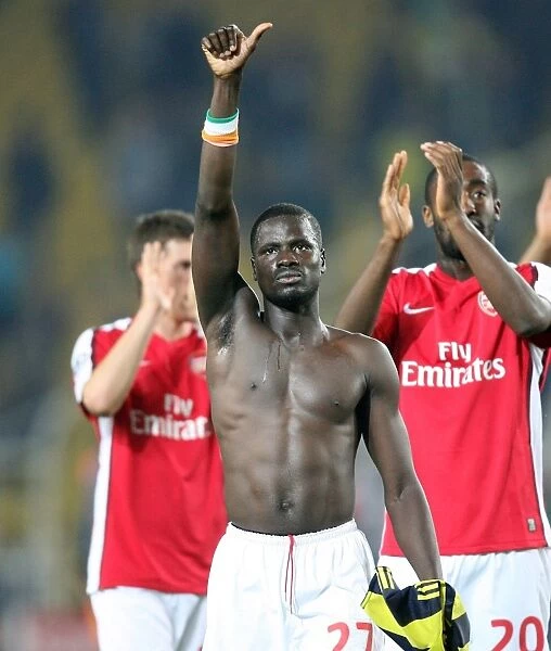 Emmanuel Eboue's Victory Thumbs-Up: Arsenal's 5-2 Win Over Fenerbahce in Champions League