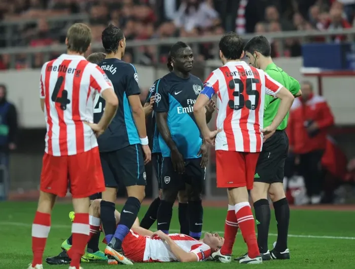 Framed Print : Emmanuel Frimpong Booked in Olympiacos vs. Arsenal UEFA Champions League Clash (December 2011)