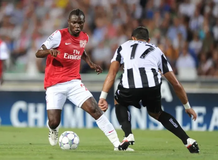 Framed Print : Emmanuel Frimpong vs Medhi Benatia: Battle in the UEFA Champions League Play-Offs (Udinese v Arsenal, 2011)
