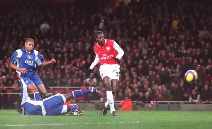 Framed Print : Emmauel Adebayor scores Arsenals 1st goal under pressure from Linvoy Primus Framed Print : Emmauel Adebayor scores Arsenals 1st goal under pressure from Linvoy Primus
