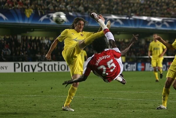 Emmauel Adebayor shoots past Villarreal goalkeeper