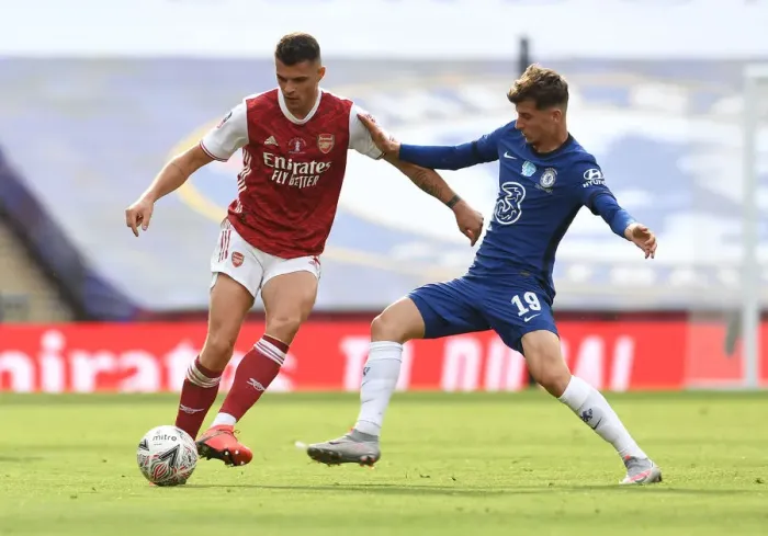 Framed Print : FA Cup Final 2020: Empty Wembley Showdown - Xhaka vs. Mount: Arsenal vs. Chelsea Clash Amidst Pandemic Framed Print : FA Cup Final 2020: Empty Wembley Showdown - Xhaka vs. Mount: Arsenal vs. Chelsea Clash Amidst Pandemic