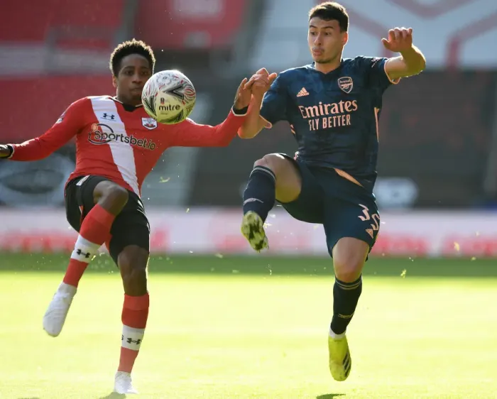 Framed Print : FA Cup Fourth Round: Southampton vs. Arsenal - Gabriel Martinelli's Battle with Walker-Peters Amid Empty Stands Framed Print : FA Cup Fourth Round: Southampton vs. Arsenal - Gabriel Martinelli's Battle with Walker-Peters Amid Empty Stands