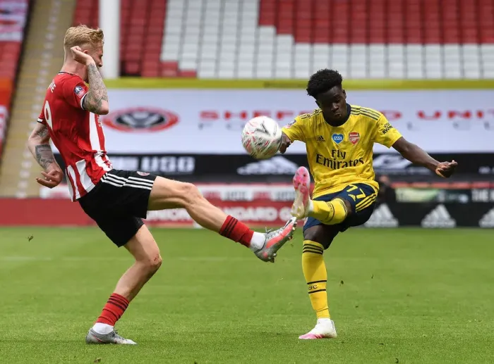 Framed Print : FA Cup Quarterfinal: Heart-stopping Moment as Olivier McBurnie Blocks Bukayo Saka's Game-Changing Cross (Sheffield United vs. Arsenal)