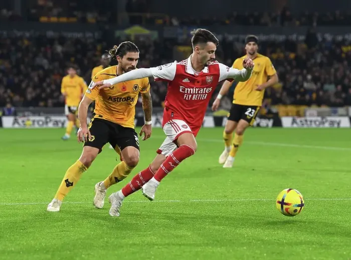 Framed Print : Fabio Vieira vs. Ruben Neves: Battle in the Midfield - Wolverhampton Wanderers vs. Arsenal FC, Premier League 2022-23