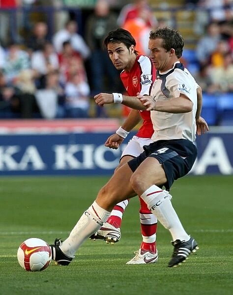 Fabregas vs. Davies: Intense Battle for Ball Possession - Arsenal vs. Bolton Wanderers, Premier League 2008-09