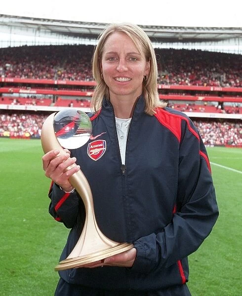 Faye White (Arsenal Ladies) on the pitch at half time to parade the Womens UEFA Cup Trophy