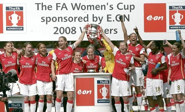 Faye White and Jayne Ludlow (Arsenal) lift the FA Cup