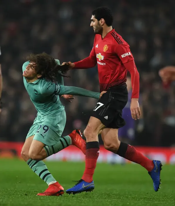 Framed Print : Fellaini vs. Guendouzi: Heading Clash in Manchester United vs. Arsenal FC Premier League Match Framed Print : Fellaini vs. Guendouzi: Heading Clash in Manchester United vs. Arsenal FC Premier League Match