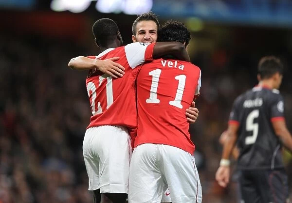 Five-Star Arsenal: Vela, Eboue, and Fabregas Triumphant Celebration in Arsenal's 6-0 Victory