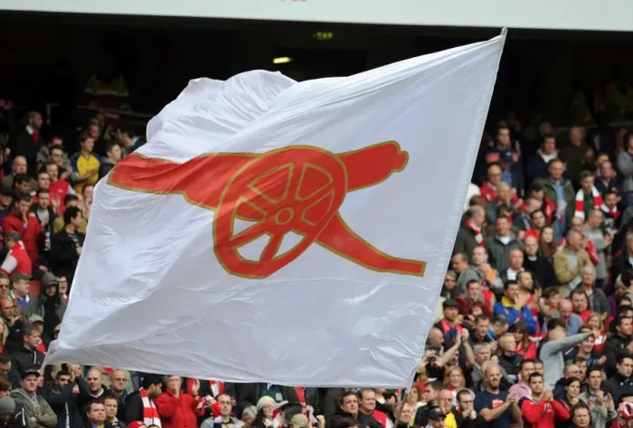 Framed Print : A flag is waved before the match. Arsenal 4: 1 Norwich City. Barclays Premier League
