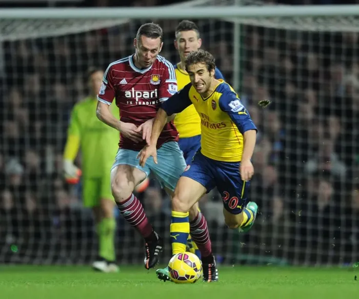 Framed Print : Flamini Surges Past Nolan: Intense Moment from West Ham vs. Arsenal (2014-15)