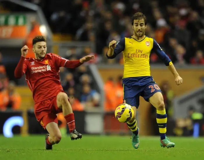 Framed Print : Flamini vs Lallana: Intense Battle in the Premier League Clash Between Liverpool and Arsenal