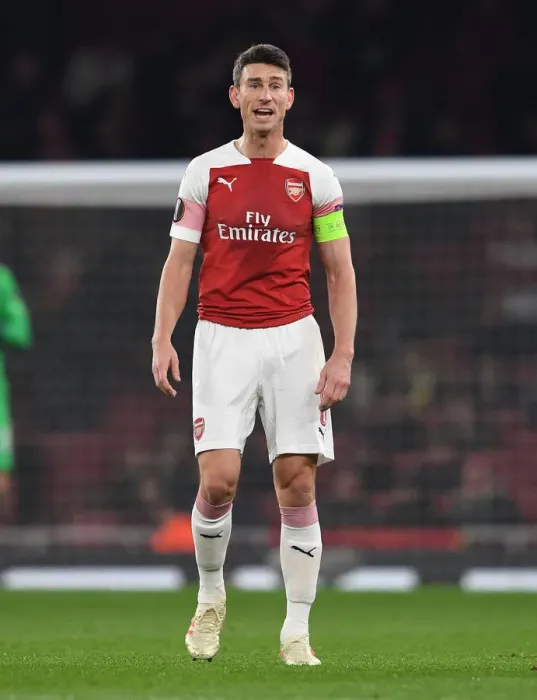 Framed Print : Focused Koscielny: Arsenal's Unyielding Defender in Europa League Battle Against Qarabag Framed Print : Focused Koscielny: Arsenal's Unyielding Defender in Europa League Battle Against Qarabag