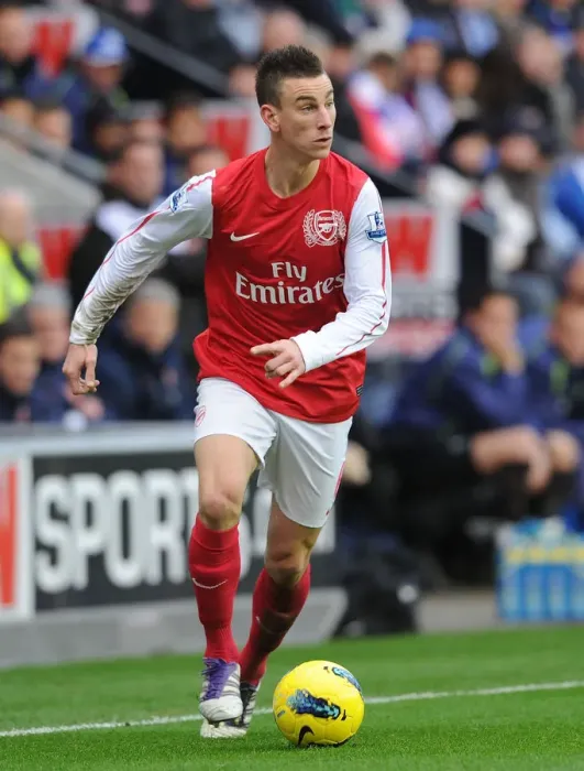Framed Print : Focused Koscielny in Wigan Athletic vs Arsenal Clash (2011-12)
